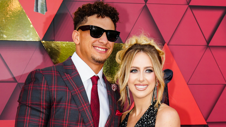 Patrick Mahomes, Brittany Mahomes posing