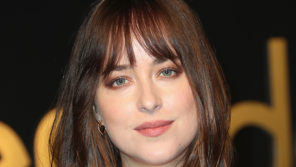 Dakota Johnson staring 