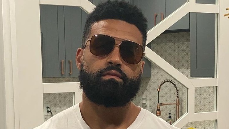 Apollo Nida wearing sunglasses