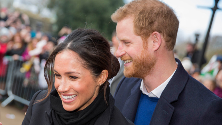 Meghan Markle ad Prince Harry smiling 
