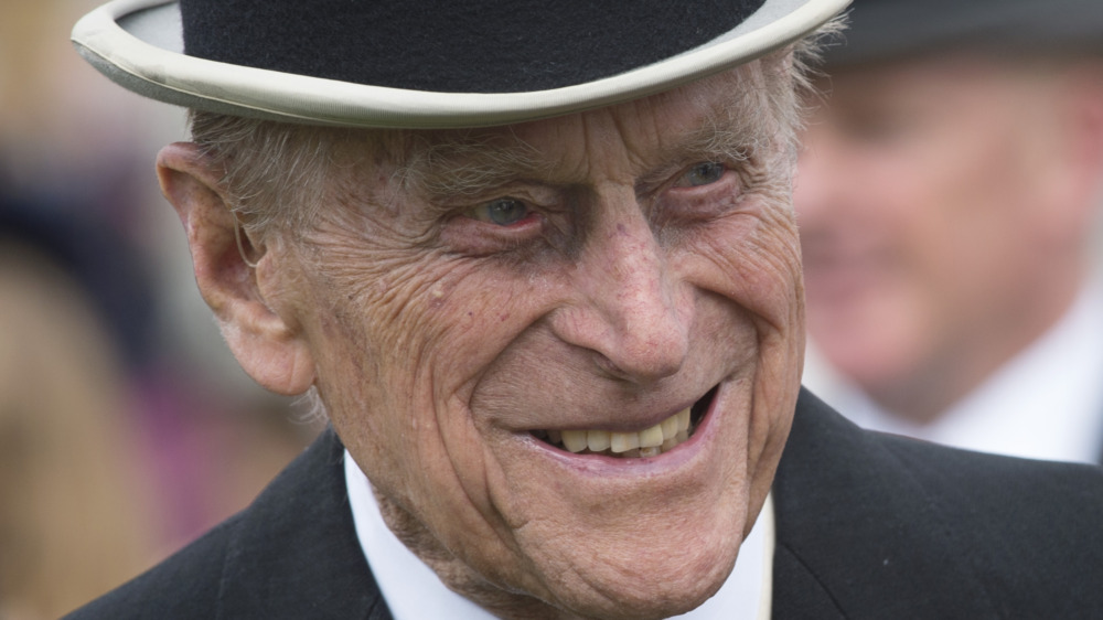 Prince Philip smiling in top hat