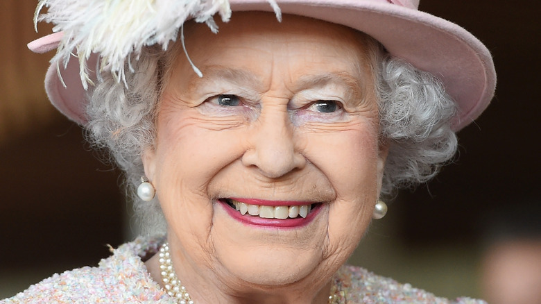 Queen Elizabeth smiles at an engagement