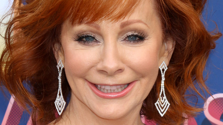 Reba McEntire wears rhinestone dangle earrings