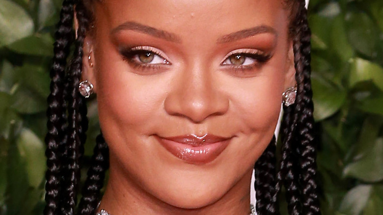 Rihanna smiling on the red carpet