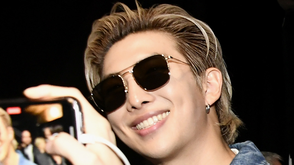 BTS RM smiles at camera