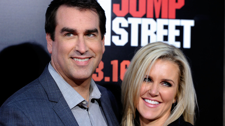 Rob Riggle and Tiffany Riggle smile for pictures on the red carpet