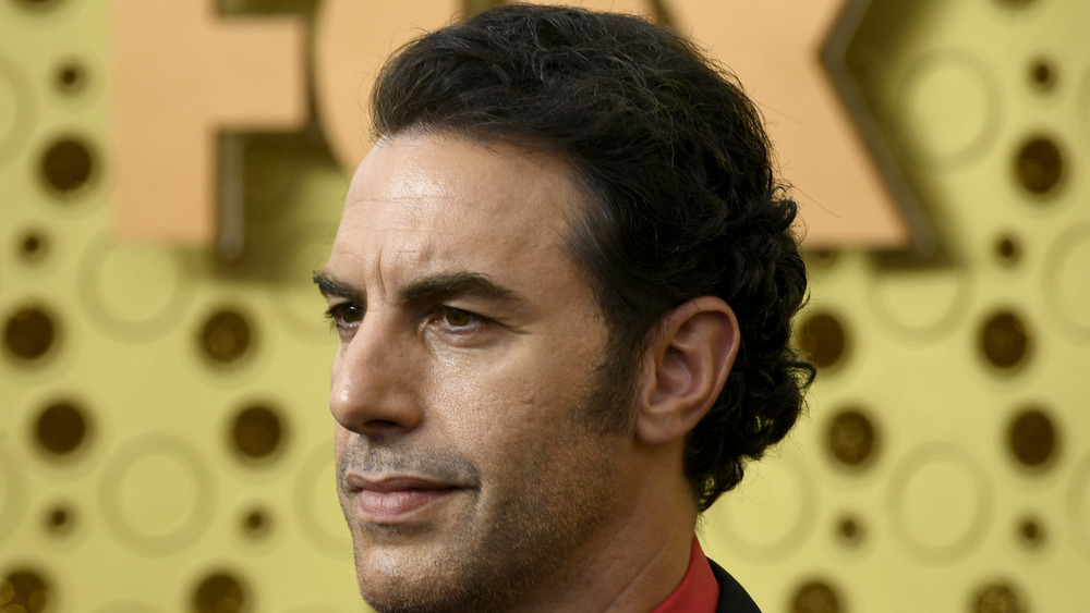 Sacha Baron Cohen staring