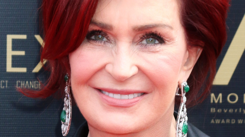 sharon osbourne dangly green earrings