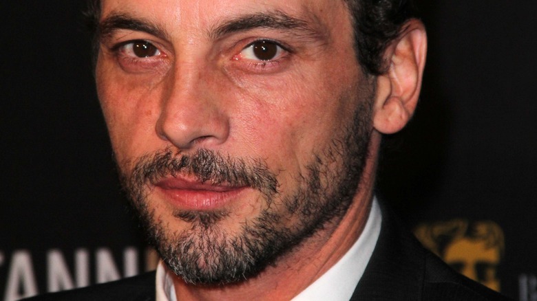 Skeet Ulrich poses in a suit