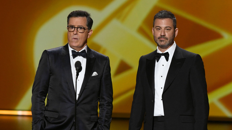 Stephen Colbert and Jimmy Kimmel in tuxedoes at an awards show