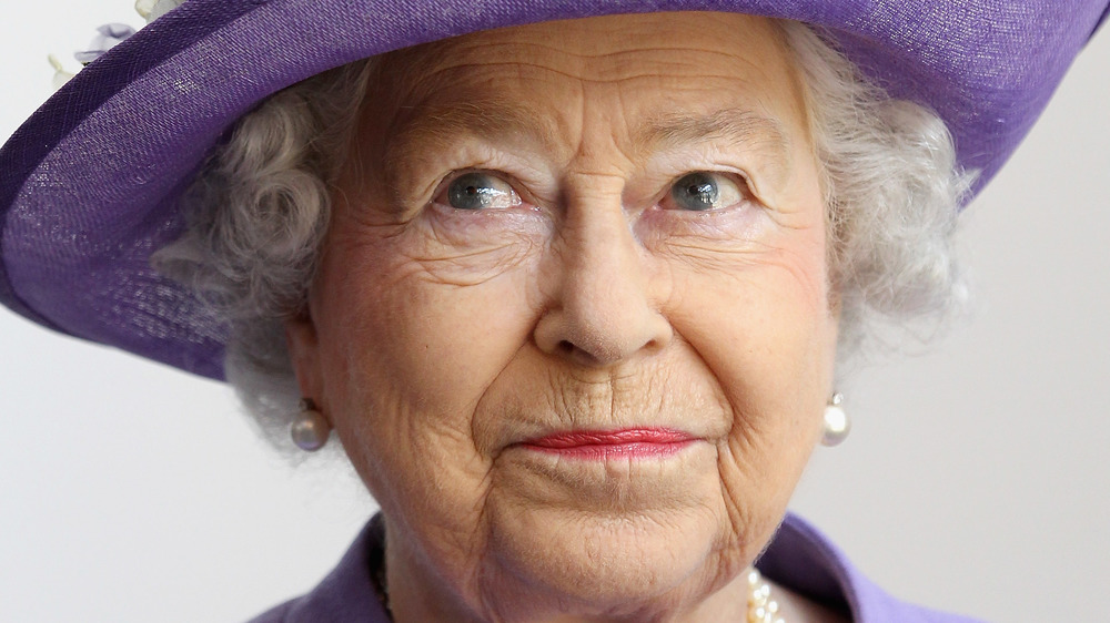 Queen Elizabeth in purple hat