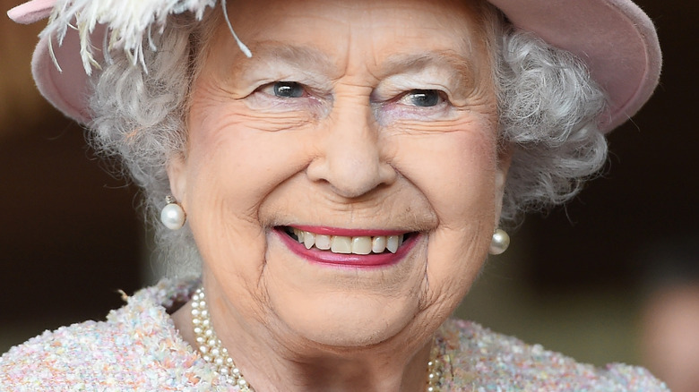 Queen Elizabeth smiles at an engagement