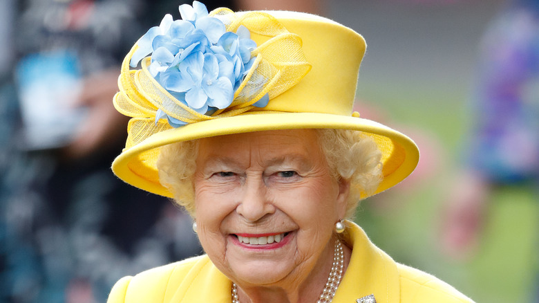 Queen Elizabeth smiles at an engagement