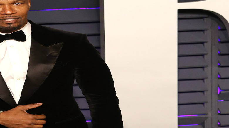 Jamie Foxx posing in a tuxedo
