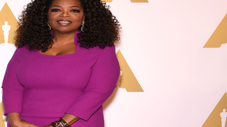 Oprah Winfrey in a purple dress