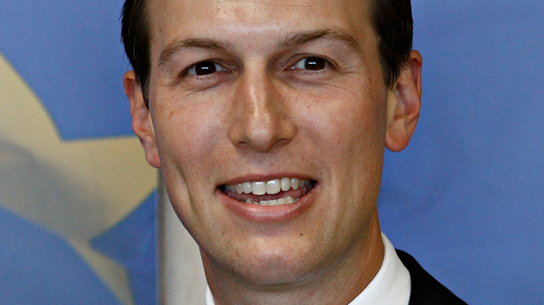 Jared Kushner smiling and looking to the side