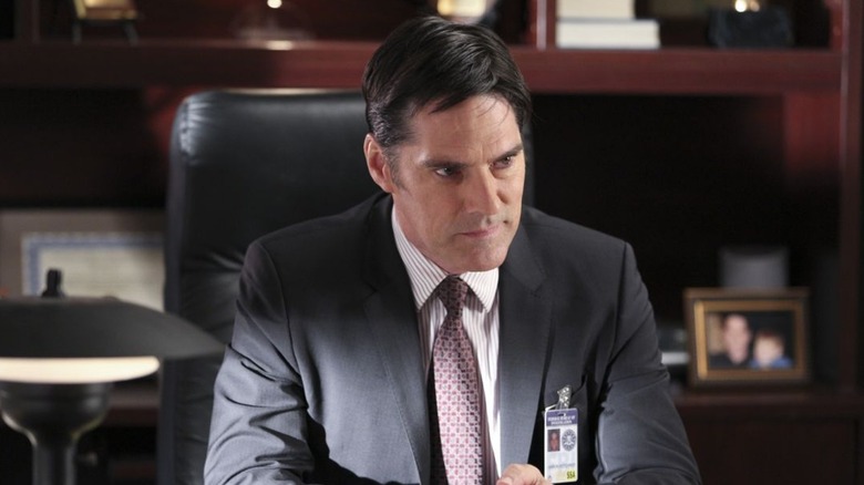  Aaron Hotchner sits at his desk looking concerned