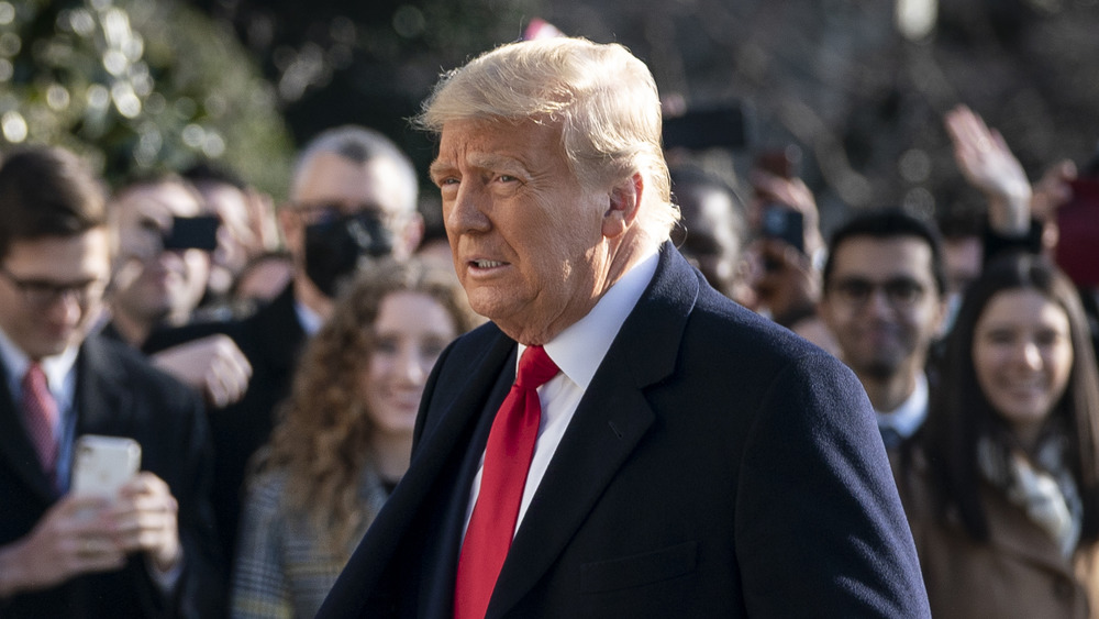 Donald Trump walking in front of crowd