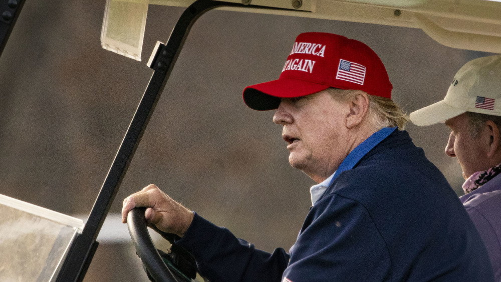 Donald Trump driving golf cart