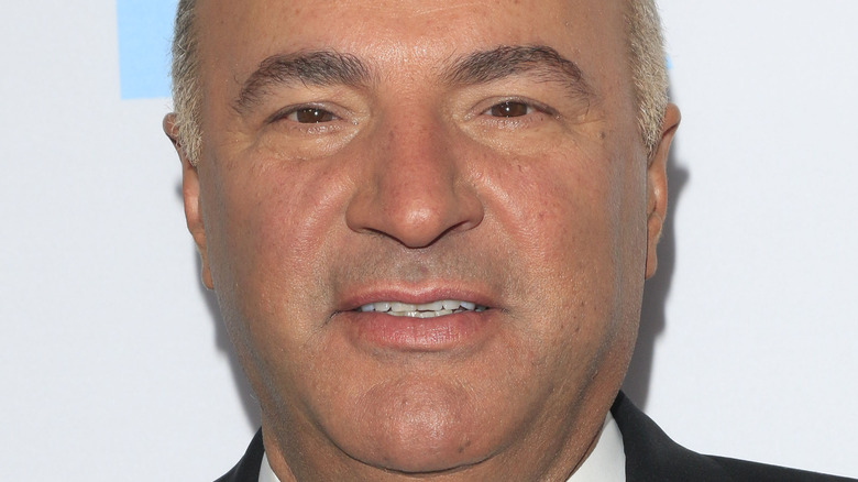 kevin o'leary smiling looking up