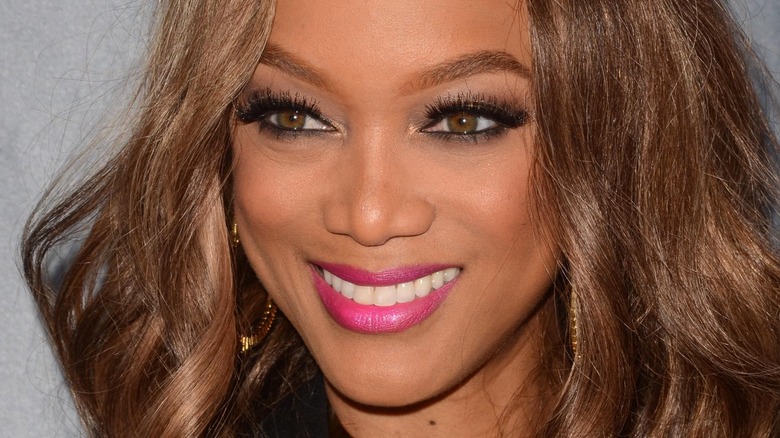 Tyra Banks smiles 