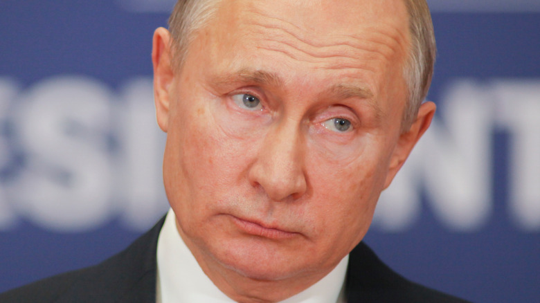 Vladimir Putin looking stoically on