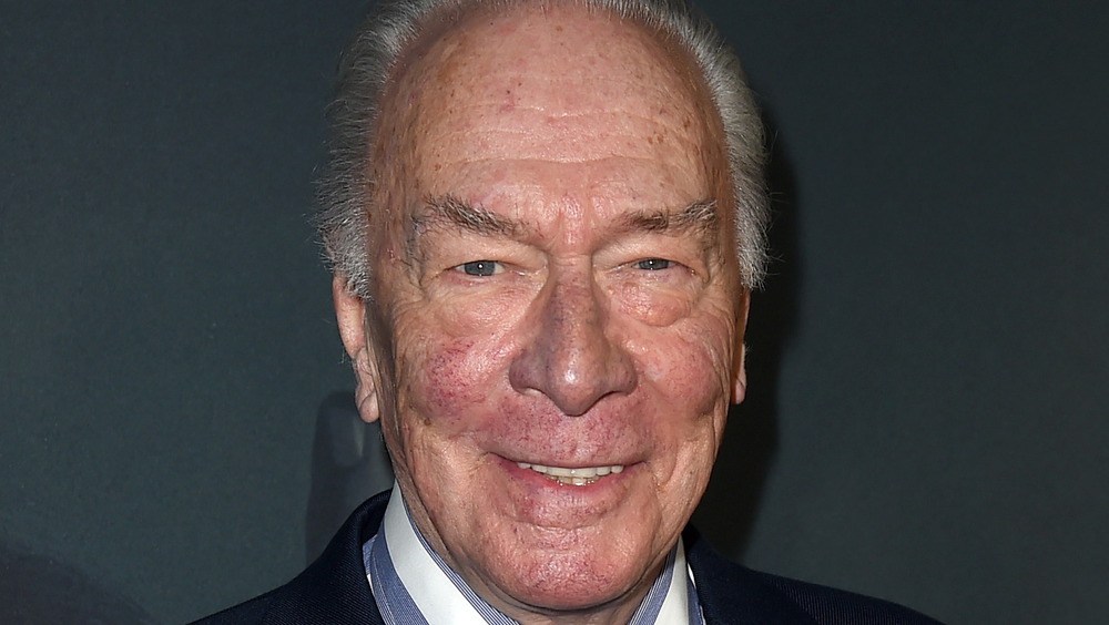 Christopher Plummer smiles for a photo at an event