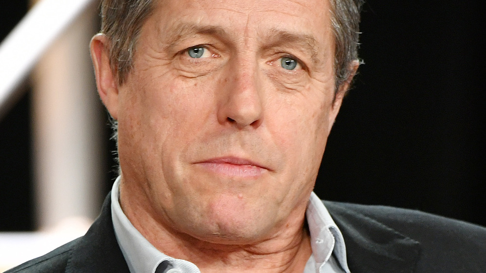 Hugh Grant headshot looking serious