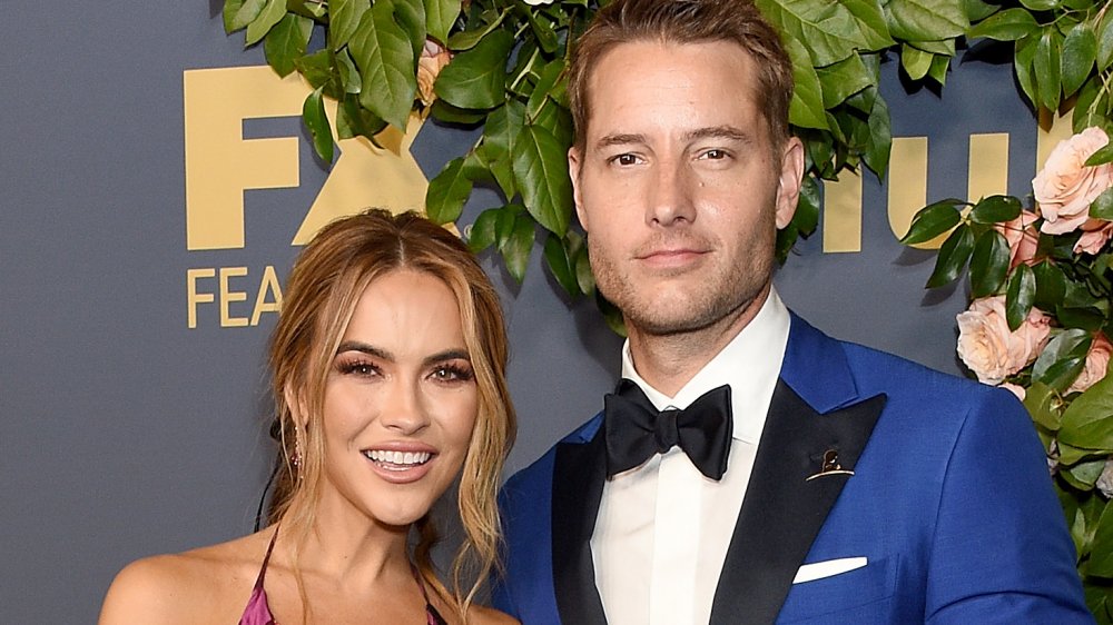 Chrishell Stause, Justin Hartley posing on the red carpet