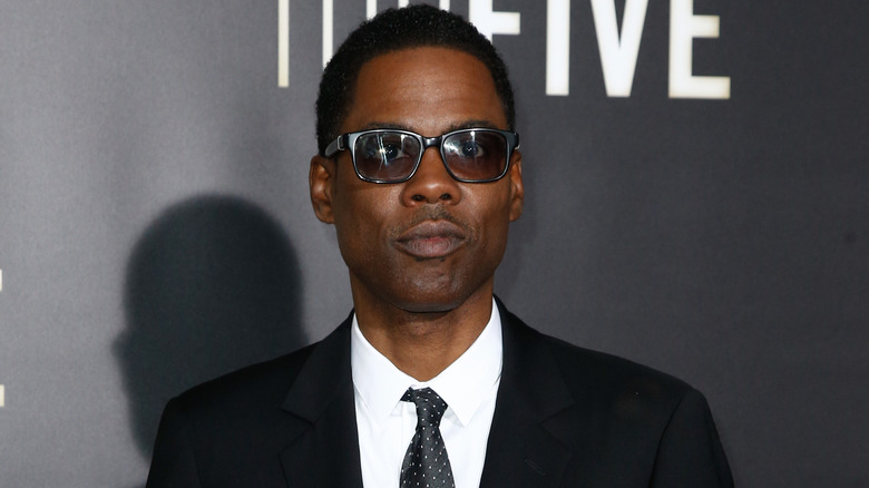 Chris Rock posing in sunglasses