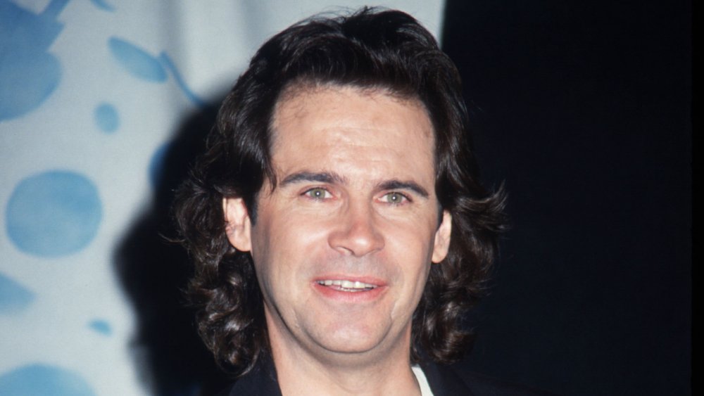 Dennis Miller smiling on the red carpet