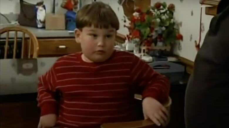 Curtis Brown sitting at the table on Wife Swap