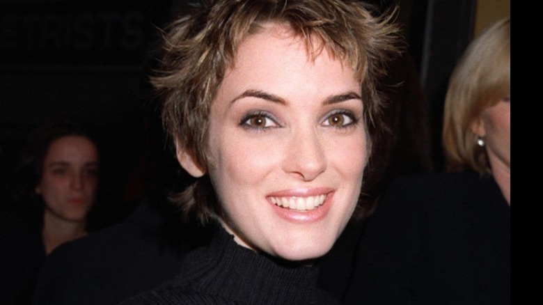 Winona Ryder with wide smile and short haircut 