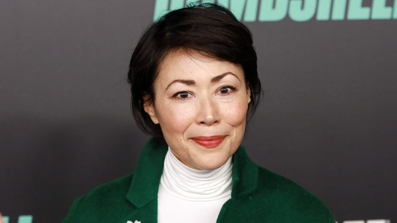 Ann Curry wearing a green coat