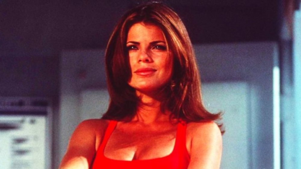 Yasmine Bleeth in a red bathing suit, playing Caroline Holden on Baywatch