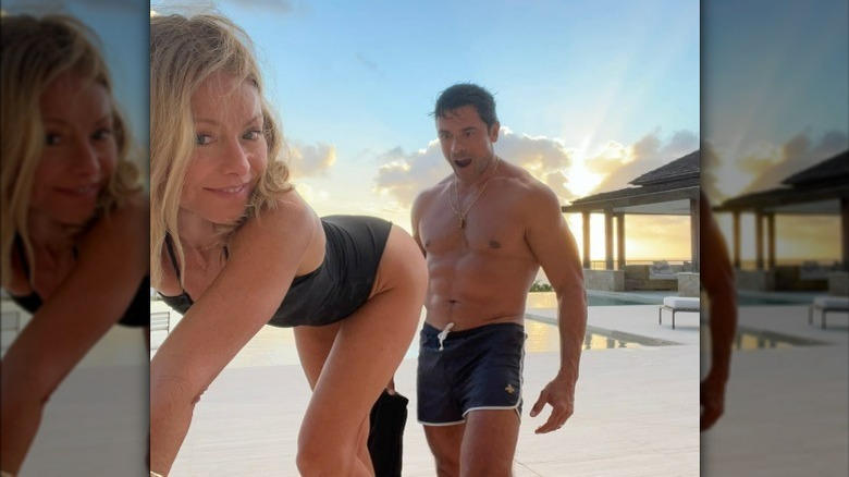 Mark Consuelos admiring Kelly Ripa in a swimsuit