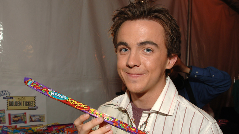 Frankie Muniz holding a Nerds Rope candy