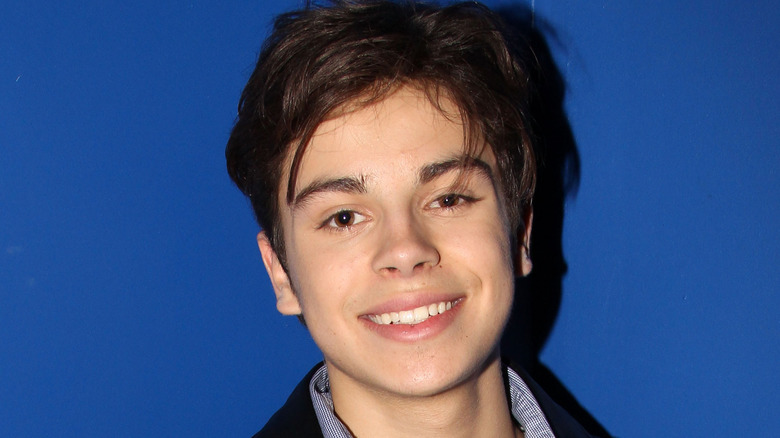Jake T. Austin smiling into camera