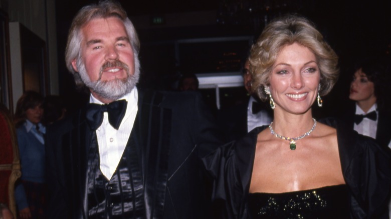 Kenny Rogers and Marianne Gordon are all smiles while Gordon looks away from the camera.