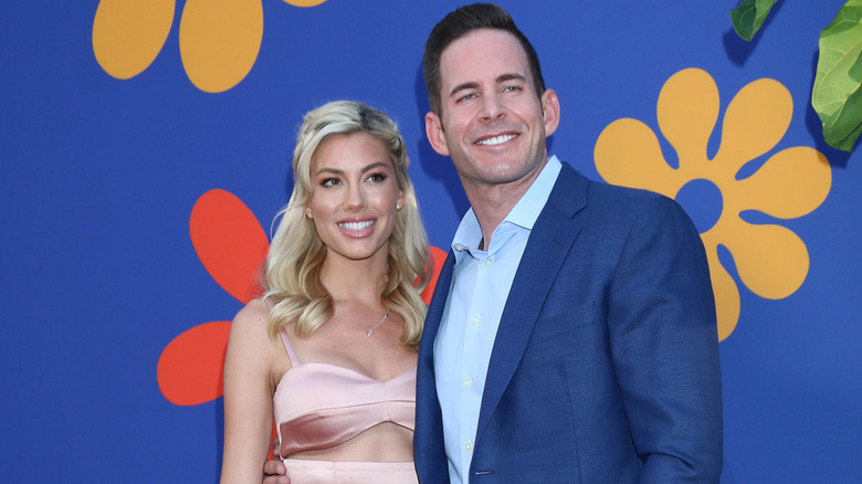 Heather Rae Young posing with Tarek El Moussa