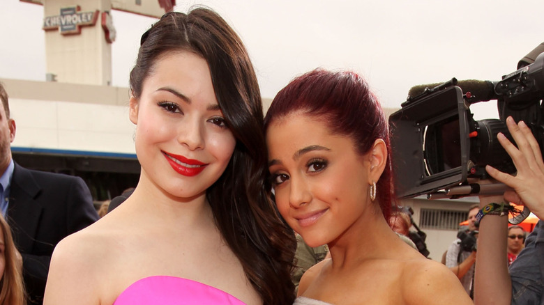 Miranda Cosgrove and Ariana Grande posing together during their Nickelodeon days