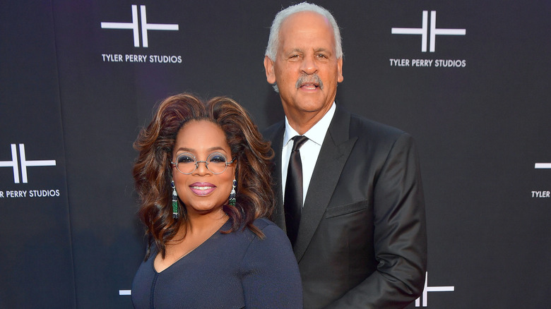 Oprah Winfrey and Stedman Graham posing at a Tyler Perry event