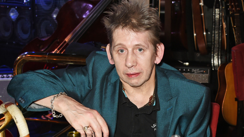 Shane MacGowan wearing blue jacket