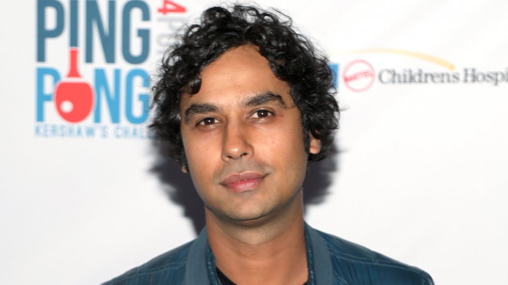 Kunal Nayyar posing with a neutral expression at a charity event