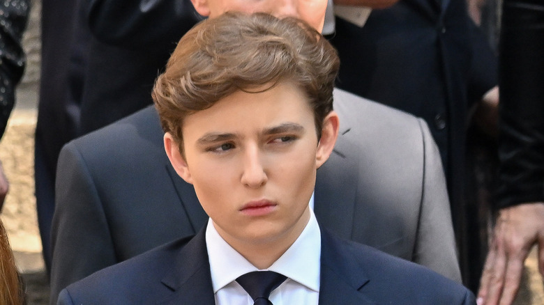 Barron Trump scowling looking sideways