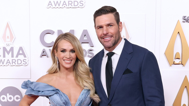 Carrie Underwood and Mike Fisher posing