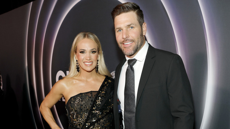 Carrie Underwood and Mike Fisher smiling