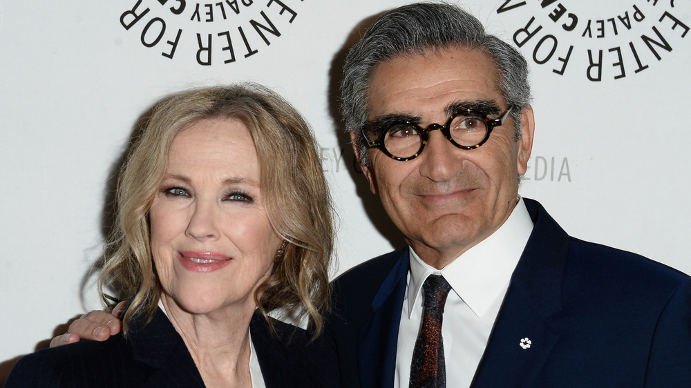 Catherine O'Hara and Eugene Levy posing on the red carpet