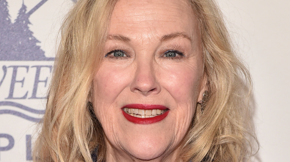 Catherine O'Hara smiling with red lipstick