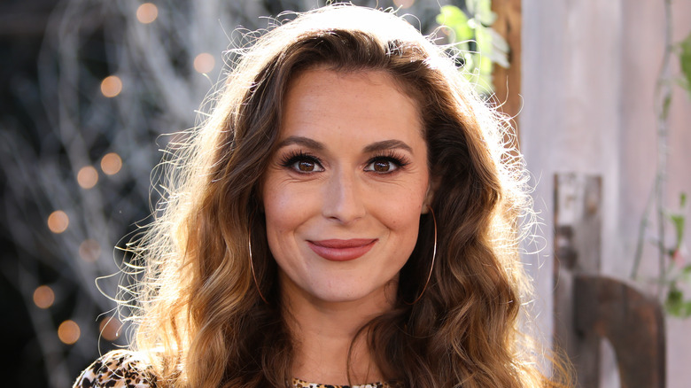 Alexa PenaVega smirking
